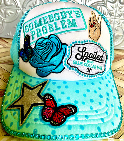 Somebody’s Problem Decorated Truckers Hat in Light Blue & White