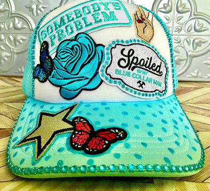 Somebody’s Problem Decorated Truckers Hat in Light Blue & White