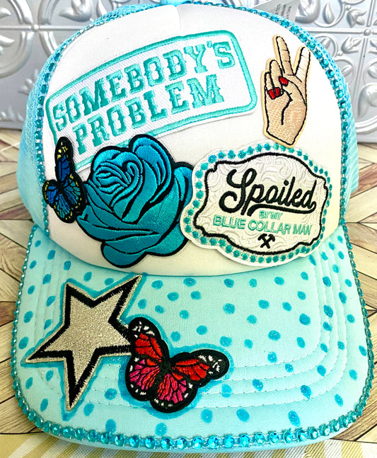 Somebody’s Problem Decorated Truckers Hat in Light Blue & White